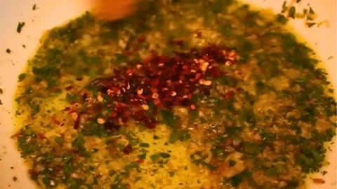 Add the dried herbs and chili flakes
